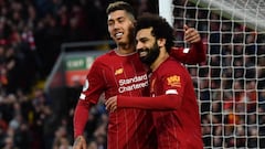 Liverpool&#039;s Egyptian midfielder Mohamed Salah (R) celebrates with Liverpool&#039;s Brazilian midfielder Roberto Firmino after scoring his team&#039;s third goal during the English Premier League football match between Liverpool and Southampton at Anf