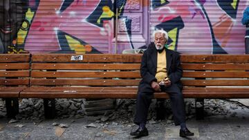 A man sits on a street bench during the government-mandated quarantine to lower the rates of contagion from the coronavirus disease (COVID-19) outbreak, in Bogota, Colombia July 27, 2020. REUTERS/Luisa Gonzalez