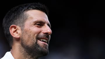 Serbia's Novak Djokovic speaks to the audience after winning his men's singles second round tennis match against Britain's Daniel Evans on the fourth day of the 2025 Wimbledon Championships at The All England Lawn Tennis and Croquet Club in Wimbledon, southwest London, on July 3, 2025. (Photo by Adrian Dennis / AFP) / RESTRICTED TO EDITORIAL USE