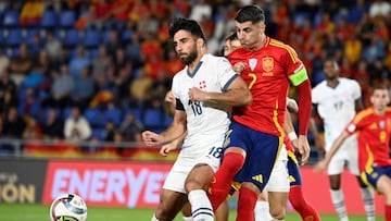 Switzerland's forward #18 Eray Comert fights for the ball with Spain's forward #07 Alvaro Morata the UEFA Nations League, League A Group A4, football match between Spain and Switzerland at the Heliodoro Rodriguez Lopez stadium in Tenerife, in Spain's Canary Islands, on November 18, 2024. (Photo by MIGUEL RIOPA / AFP)