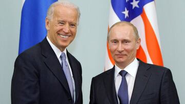 (FILES) In this file photo taken on March 10, 2011, Russian Prime Minister Vladimir Putin (R) shakes hands with US Vice President Joe Biden during their meeting in Moscow. - US President Joe Biden in his first phone call with Vladimir Putin since taking o