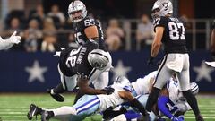 Las Vegas Raiders running back Damien Williams (32) is tackled by the Dallas Cowboys