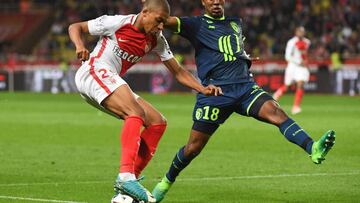 Monaco's French forward Kylian Mbappe Lottin vies with Lille's French defender Franck Beria during the French L1 football match between Monaco (ASM) and Lille (LOSC) at the Louis II Stadium in Monaco on May 14,2017. / AFP PHOTO / Yann COATSALIOU