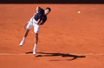 Djokovic serves to Nadal in today's semi-final in Madrid.