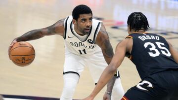 Jan 20, 2021; Cleveland, Ohio, USA; Brooklyn Nets guard Kyrie Irving (11) dribbles against the Cleveland Cavaliers in the first quarter at Rocket Mortgage FieldHouse. Mandatory Credit: David Richard-USA TODAY Sports