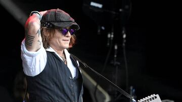 Johnny Depp performs on stage with Jeff Beck during the Helsinki Blues Festival in Helsinki on June, 19, 2022