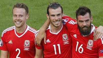 Wales' Chris Gunter, Gareth Bale and Joe Ledley celebrate after beating Slovakia 2-1.