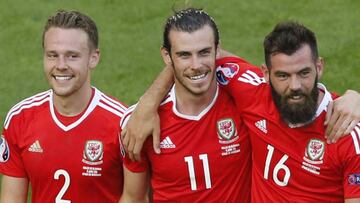 Wales' Chris Gunter, Gareth Bale and Joe Ledley celebrate after beating Slovakia 2-1.