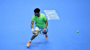 Spain's Carlos Alcaraz returns to Germany's Alexander Zverev during their first round-robin match at the ATP Finals tennis tournament in Turin, on November 13, 2023. (Photo by Tiziana FABI / AFP)