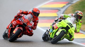MotoGP - German Grand Prix - Sachsenring, Hohenstein-Ernstthal, Germany - July 12, 2025 Ducati Lenovo Team's Marc Marquez and Pertamina Enduro VR46 Racing Team's Fabio Di Giannantonio in action during the sprint race REUTERS/Lisi Niesner