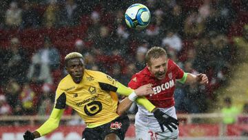 Monaco's Polish defender Kamil Glik (R) fights for the ball with Lille's Nigerian forward Victor Osimhen (L during the French L1 football match between AS Monaco (ASM) and Lille OSC (LOSC) at the "Louis II" stadium in Monaco, on Decemb