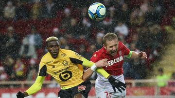 Monaco&#039;s Polish defender Kamil Glik (R) fights for the ball with Lille&#039;s Nigerian forward Victor Osimhen (L during the French L1 football match between AS Monaco (ASM) and Lille OSC (LOSC) at the &quot;Louis II&quot; stadium in Monaco, on Decemb