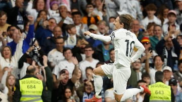 Real Madrid's Croatian midfielder #10 Luka Modric celebrates scoring the opening goal during the Spanish league football match between Real Madrid CF and Girona FC at Santiago Bernabeu Stadium in Madrid on February 23, 2025. (Photo by Pierre-Philippe MARCOU / AFP)