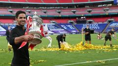 Arsenal&#039;s Spanish head coach Mikel Arteta holds the winner&#039;s trophy as the team celebrates victory after the English FA Cup final football match between Arsenal and Chelsea at Wembley Stadium in London, on August 1, 2020. - Arsenal won the match