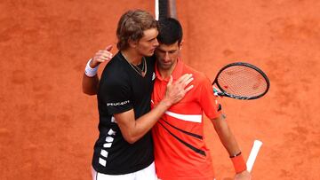 PARIS, FRANCE - JUNE 06: Novak Djokovic of Serbia embraces Alexander Zverev of Germany following their mens singles quarter-final match during Day twelve of the 2019 French Open at Roland Garros on June 06, 2019 in Paris, France. (Photo by Clive Brunskill/Getty Images)