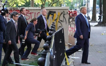 Busy times | US President Donald Trump walks near protestors in Lafayette Park shielded by Secret Service agents during ongoing protests over racial inequality in the wake of the death of George Floyd while in Minneapolis police custody.
