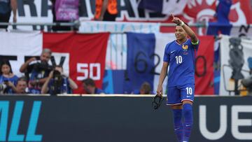 France's forward #10 Kylian Mbappe celebrates scoring his team's first goal from the penalty spot during the UEFA Euro 2024 Group D football match between France and Poland at the BVB Stadion in Dortmund on June 25, 2024. (Photo by FRANCK FIFE / AFP)