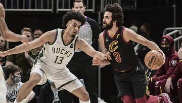 Dec 18, 2021; Milwaukee, Wisconsin, USA; Cleveland Cavaliers guard Ricky Rubio (3) drives for the basket against Milwaukee Bucks forward Jordan Nwora (13) in the second quarter at Fiserv Forum. Mandatory Credit: Benny Sieu-USA TODAY Sports