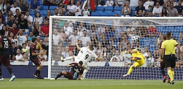 Karim Benzema (centre) heads Real Madrid into a second-minute lead.