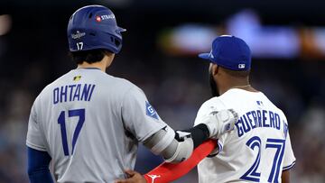 TORONTO, ONTARIO - OCTOBER 25: Shohei Ohtani #17 of the Los Angeles Dodgers talks with Vladimir Guerrero Jr. #27 of the Toronto Blue Jays during the eighth inning in game two of the 2025 World Series at Rogers Center on October 25, 2025 in Toronto, Ontario. Emilee Chinn/Getty Images/AFP (Photo by Emilee Chinn / GETTY IMAGES NORTH AMERICA / Getty Images via AFP)
