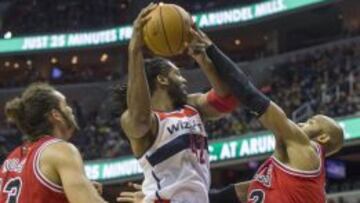 Acción de Nene Hilario ante los Bulls.