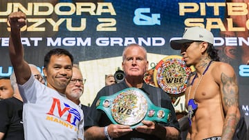 LAS VEGAS, NEVADA - JULY 18: TGB Promotions President Tom Brown (C) looks on as Manny Pacquiao (L) and WBC welterweight champion Mario Barrios (R) attend a ceremonial weigh-in at MGM Grand Garden Arena on July 18, 2025 in Las Vegas, Nevada. Barrios is scheduled to defend his title against Pacquiao, who announced he was coming out of retirement nearly four years after his last fight, on July 19. Ethan Miller/Getty Images/AFP (Photo by Ethan Miller / GETTY IMAGES NORTH AMERICA / Getty Images via AFP)