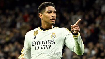 Real Madrid's English midfielder #5 Jude Bellingham celebrates scoring his team's second goal during the UEFA Champions League first round group C football match between Real Madrid CF and SSC Naples at the Santiago Bernabeu stadium in Madrid on November 29, 2023. (Photo by JAVIER SORIANO / AFP)