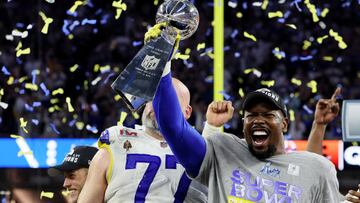 American Football  - NFL - Super Bowl LVI - Cincinnati Bengals v Los Angeles Rams - SoFi Stadium, Inglewood, California, United States - February 13, 2022 Los Angeles Rams&#039; Von Miller and Andrew Whitworth celebrate with the Vince Lombardi Trophy afte
