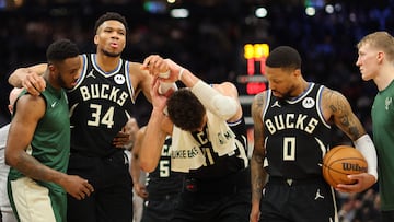 MILWAUKEE, WISCONSIN - APRIL 09: Giannis Antetokounmpo #34 of the Milwaukee Bucks is helped off the court by Thanasis Antetokounmpo #43 and Brook Lopez #11 after suffering an injury during the second half of a game against the Boston Celtics at Fiserv Forum on April 09, 2024 in Milwaukee, Wisconsin. NOTE TO USER: User expressly acknowledges and agrees that, by downloading and or using this photograph, User is consenting to the terms and conditions of the Getty Images License Agreement.   Stacy Revere/Getty Images/AFP (Photo by Stacy Revere / GETTY IMAGES NORTH AMERICA / Getty Images via AFP)