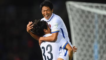 YOKOHAMA, JAPAN - DECEMBER 08:  Mu Kanazaki of Kashima Antlers (33) celebrates with Shuhei Akasaki as he scores their second goal during the FIFA Club World Cup Play-off for Quarter Final match between Kashima Antlers and Auckland City at International St