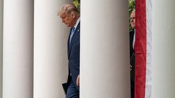 US President Donald J. Trump and Vice President Mike Pence arrive to give an update on the nation&#039;s Coronavirus Testing Strategy, in the Rose Garden of the White House, in Washington, DC. 