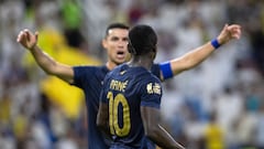 Nassr's Portuguese forward #07 Cristiano Ronaldo (back) celebrates with Nassr's Senegalese Forward #10 Sadio Mane after scoring during the Saudi Pro League football match between Al-Nassr and Al-Hazem at the King Abdullah Sports City in Buraidah, on September 2, 2023. (Photo by AFP)