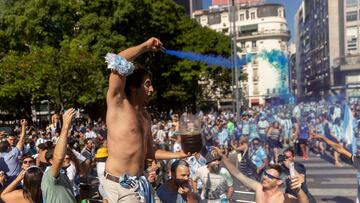 Fans of Argentina celebrate winning the Qatar 2022 World Cup against France at 9 de Julio avenue in Buenos Aires, on December 18, 2022. (Photo by TOMAS CUESTA / AFP)