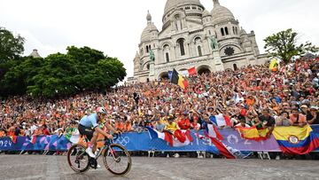 Paris 2024 Olympics - Road Cycling - Men's Road Race - Trocadero, Paris, France - August 03, 2024. Remco Evenepoel of Belgium in front of the Basilique du Sacre-Coeur in Montmartre during the race REUTERS/Angelika Warmuth