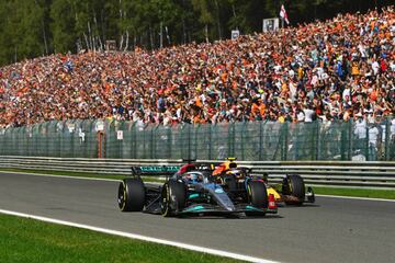 SPA, BELGIUM - AUGUST 28: George Russell of Great Britain driving the (63) Mercedes AMG Petronas F1 Team W13 leads Sergio Perez of Mexico driving the (11) Oracle Red Bull Racing RB18 during the F1 Grand Prix of Belgium at Circuit de Spa-Francorchamps on August 28, 2022 in Spa, Belgium. (Photo by Dan Mullan/Getty Images)