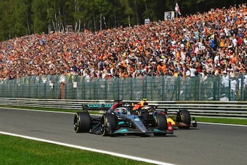 SPA, BELGIUM - AUGUST 28: George Russell of Great Britain driving the (63) Mercedes AMG Petronas F1 Team W13 leads Sergio Perez of Mexico driving the (11) Oracle Red Bull Racing RB18 during the F1 Grand Prix of Belgium at Circuit de Spa-Francorchamps on August 28, 2022 in Spa, Belgium. (Photo by Dan Mullan/Getty Images)