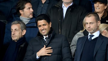 (From L) France's former president Nicolas Sarkozy, president of Paris Saint-Germain Nasser Al-Khelaifi and UEFA president Aleksander Ceferin attend to watch first leg of the UEFA Champions League round of 16 football match between Paris Saint-Germain (PSG) and FC Bayern Munich at the Parc des Princes stadium in Paris on February 14, 2023. (Photo by FRANCK FIFE / AFP)