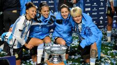 Players of Argentina celebrate with the trophy at the end of the friendly football match between Argentina and Peru, ahead of the upcoming FIFA Women's World Cup, at the Estadio Unico de San Nicolas, Buenos Aires province, on July 14, 2023. (Photo by Marcelo Manera / AFP)