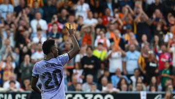 Real Madrid's Brazilian forward Vinicius Junior gestures to the stands during the Spanish league football match between Valencia CF and Real Madrid CF at the Mestalla stadium in Valencia on May 21, 2023. (Photo by JOSE JORDAN / AFP)