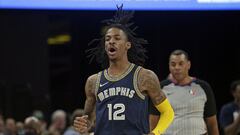 Feb 28, 2022; Memphis, Tennessee, USA; Memphis Grizzles guard Ja Morant (12) reacts after a basket during the first half against the San Antonio Spurs at FedExForum. Mandatory Credit: Petre Thomas-USA TODAY Sports