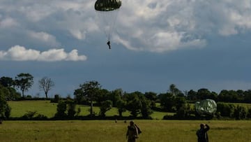 Paratroopers land after they jumped from a C-47 DC3 G-ANAF Pegasus aircraft during the celebrations for the 78th D-Day anniversary, marking the WWII Normandy landings of June 6, 1944, in Sainte-Mere-Eglise on June 5, 2022.