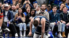 Feb 2, 2023; Dallas, Texas, USA; Dallas Mavericks guard Luka Doncic (77) kneels on the floor after he is fouled by New Orleans Pelicans forward Brandon Ingram (not pictured) as he drives to the basket during the second half at the American Airlines Center. Mandatory Credit: Jerome Miron-USA TODAY Sports