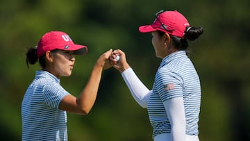 Sep 14, 2024; Gainesville, Virginia, USA; Rose Zhang, right, and Andrea Lee of Team USA fist bump after a putt on the 11th green during Foursomes matches against Team Europe during the second round of the Solheim Cup 2024 at Robert Trent Jones Golf Club. Mandatory Credit: Aaron Doster-Imagn Images