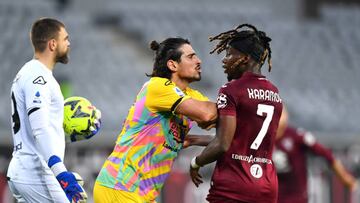 TURIN, ITALY - JANUARY 15: Dimitris Nikolaou of Spezia Calcio reacts with Yann Karamoh of Torino FC during the Serie A match between Torino FC and Spezia Calcio at Stadio Olimpico di Torino on January 15, 2023 in Turin, Italy. (Photo by Valerio Pennicino/Getty Images)