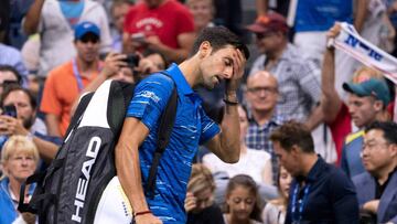 Novak Djokovic of Serbia leaves the court as he concedes the match to Stan Wawrinka of Switzerland during their Round Four Men's Singles match at the 2019 US Open at the USTA Billie Jean King National Tennis Center in New York on September 1, 2019. (