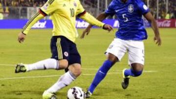 Colombia&#039;s midfielder James Rodriguez and Brazil&#039;s midfielder Fernandinho  in Santiago, Chile, on June 17, 2015. AFP PHOTO / LUIS ACOSTA