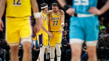 CHARLOTTE, NORTH CAROLINA - NOVEMBER 10: Luka Doncic #77 reacts after Austin Reaves #15 of the Los Angeles Lakers hits a half court shot during the second half of a basketball game against the Charlotte Hornets at Spectrum Center on November 10, 2025 in Charlotte, North Carolina. NOTE TO USER: User expressly acknowledges and agrees that, by downloading and or using this photograph, User is consenting to the terms and conditions of the Getty Images License Agreement. (Photo by David Jensen/Getty Images)