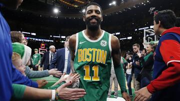 Boston Celtics&#039; Kyrie Irving walks off the court after the Celtics defeated the Philadelphia 76ers 121-114  in overtime during an NBA basketball game in Boston, Tuesday, Dec. 25, 2018.  *** Local Caption *** .