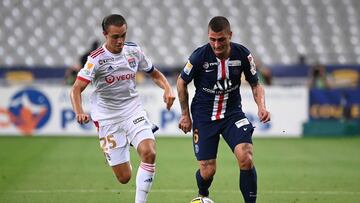 Lyon&#039;s French midfielder Maxence Caqueret (L) vies with Paris Saint-Germain&#039;s Italian midfielder Marco Verratti during the French League Cup final football match between Paris Saint-Germain vs Olympique Lyonnais at the Stade de France in Saint-D