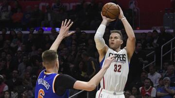 Mar 20, 2017; Los Angeles, CA, USA; LA Clippers forward Blake Griffin (32) shoots over New York Knicks forward Kristaps Porzingis (6) during the second half of a NBA basketball game at Staples Center. Mandatory Credit: Richard Mackson-USA TODAY Sports
